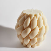 Close-up of Boujie Centrestage Knitted Cable Decorative Candle showing twisted knit design